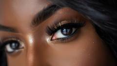 a black woman with perfect Skin, stunning Lashes, and Beautiful Eyes